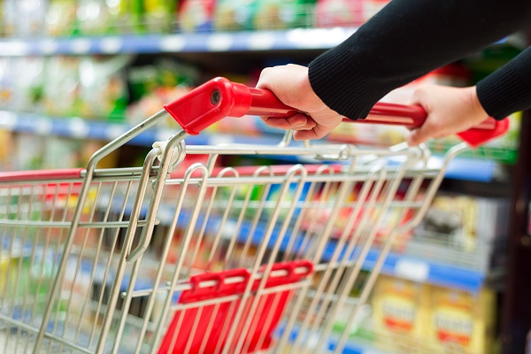 25120488 - lady pushing a shopping cart in the supermarket
